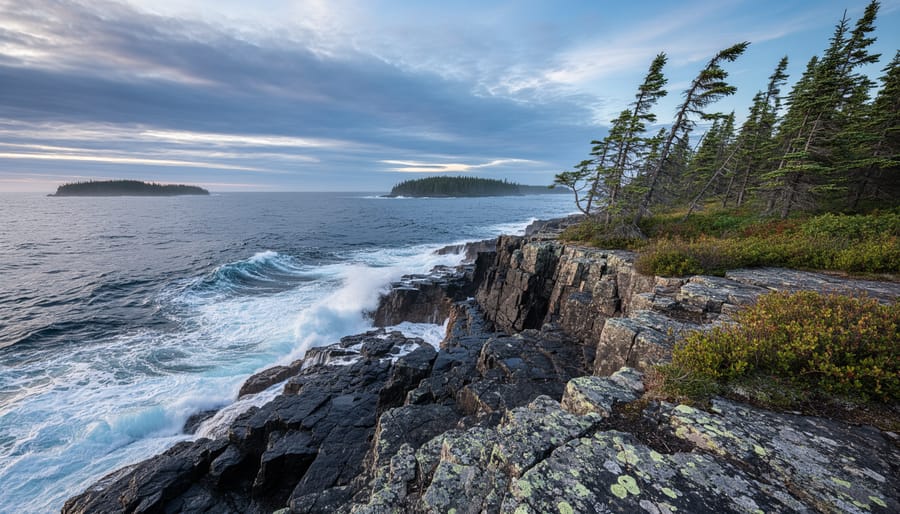 Rugged rocky shoreline on Isle Royale with Lake Superior waves under an overcast sky