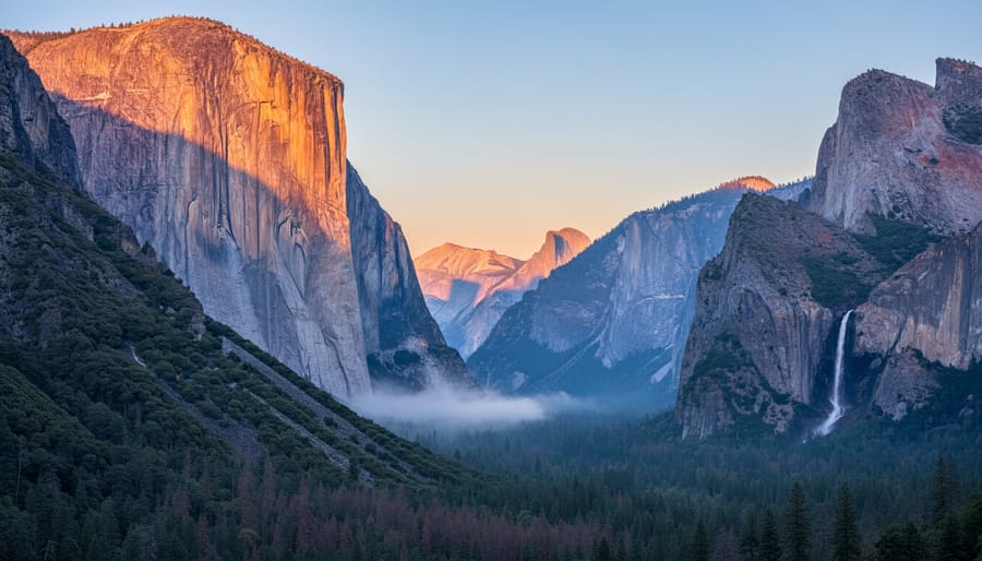 Yosemite Valley granite cliffs with waterfall during sunrise
